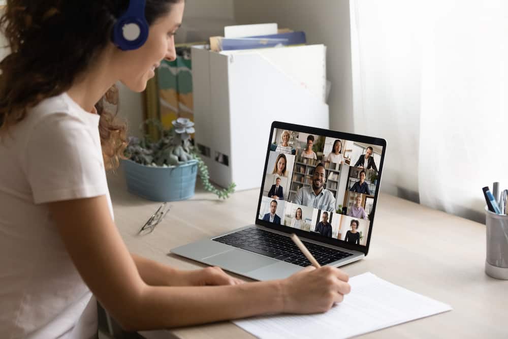 woman participating in online meeting