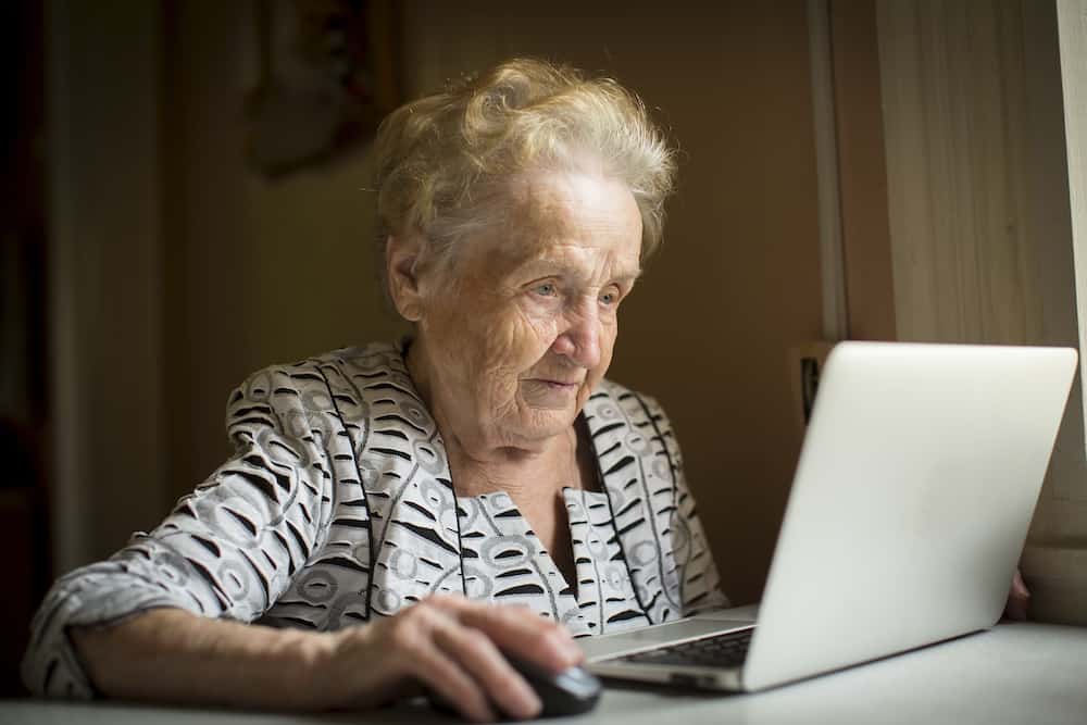 older woman sitting at computer